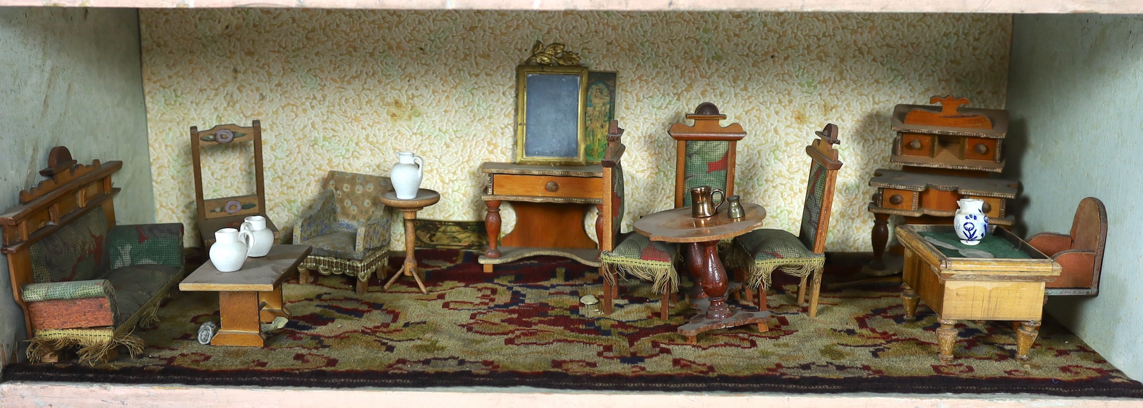 A Victorian furnished dolls’ house, circa 1890, 77cm high.